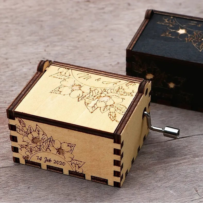 Enchanted Music Boxes cherry blossoms plywood hand-crank music box with custom floral engraving and date on lid