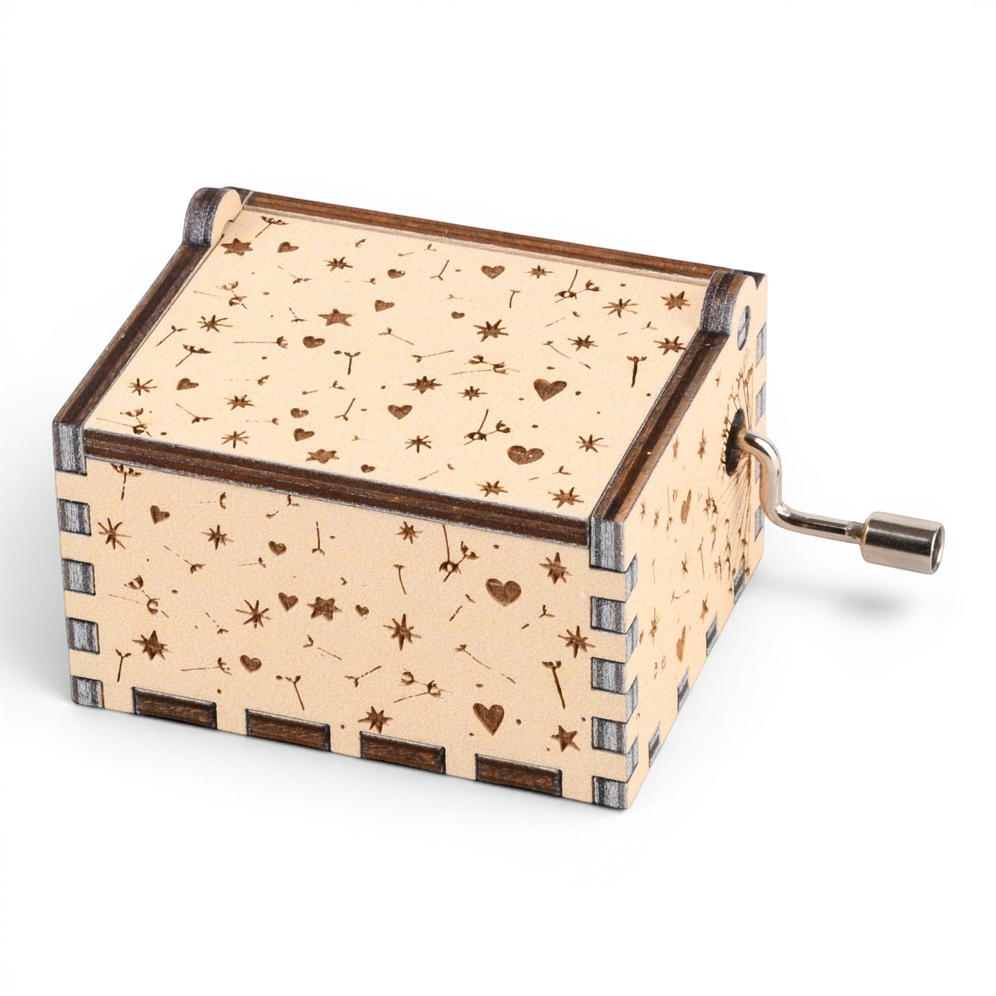 Enchanted Music Boxes hand-crank music box in light plywood with laser-engraved dandelion, heart, and star patterns.