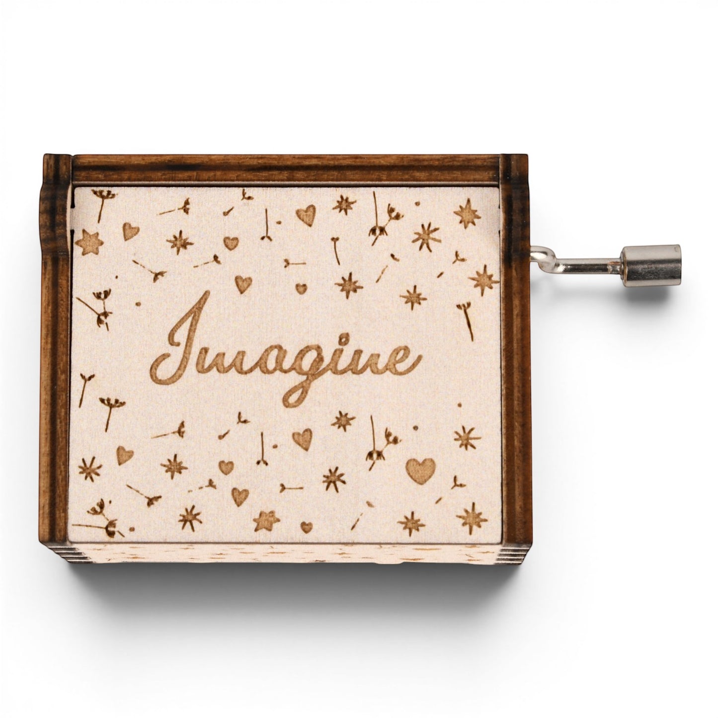 Enchanted Music Boxes hand-crank music box with dandelion, heart, and star engravings and the word Imagine on the lid.