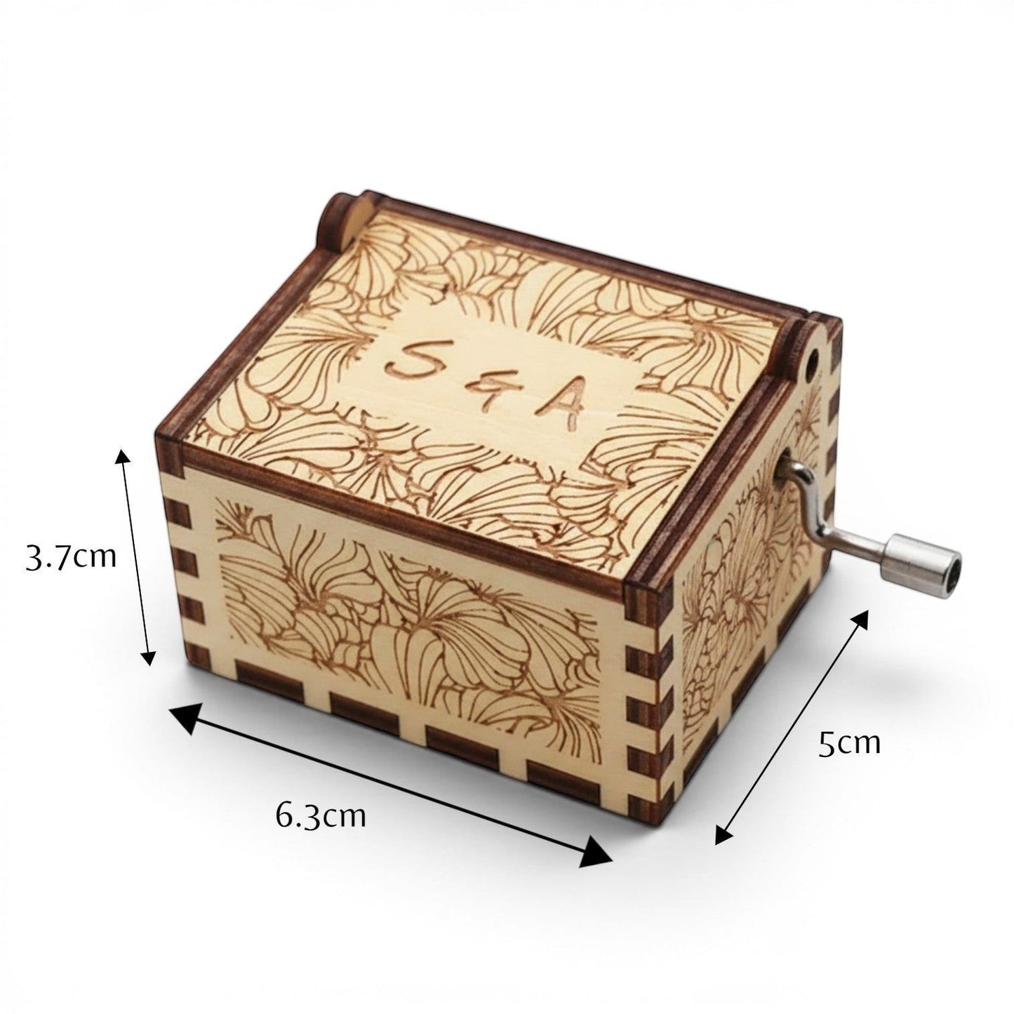 Enchanted Music Boxes laser-engraved plywood hand-crank music box with floral patterns and custom initials on the lid.
