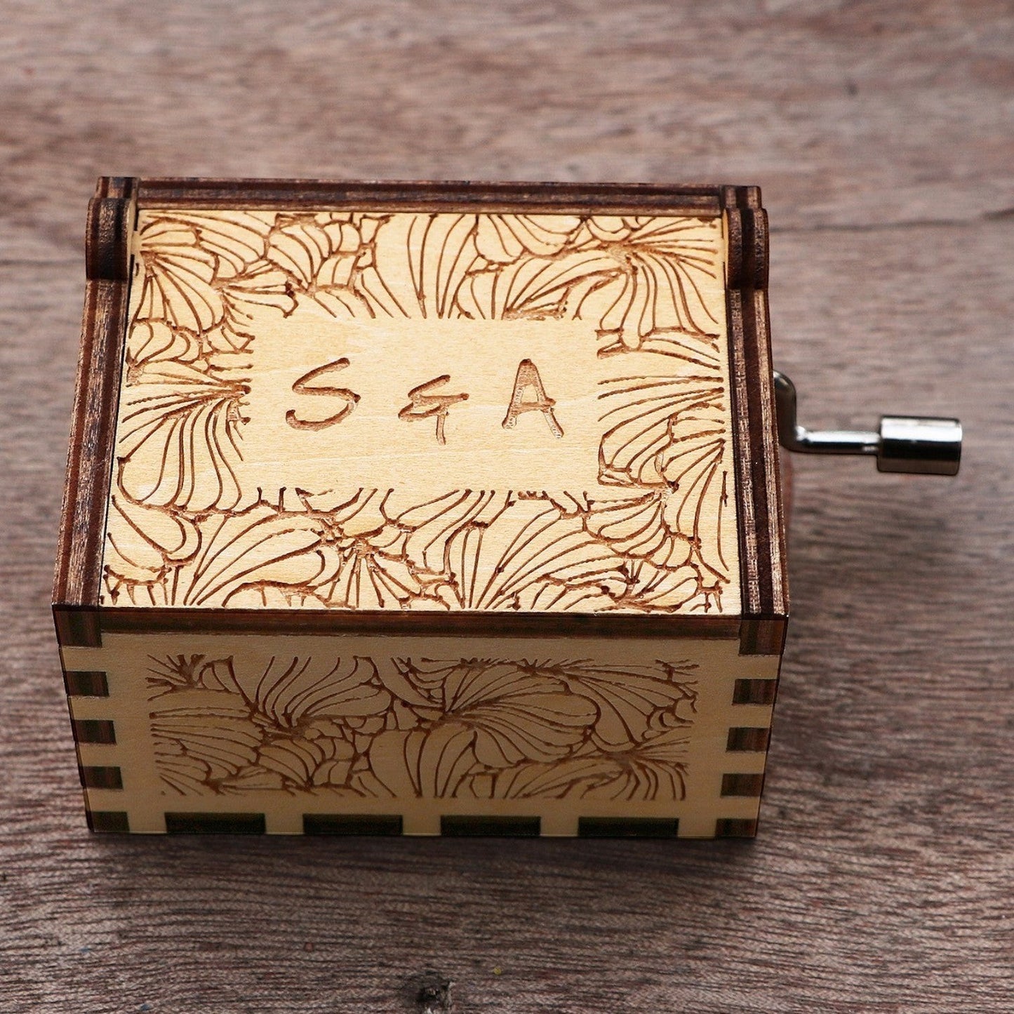 Enchanted Music Boxes laser-engraved plywood music box with floral patterns and custom initials on the lid