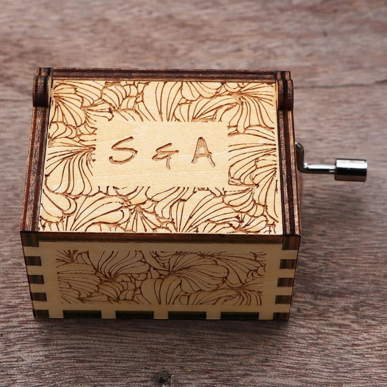 Enchanted Music Boxes laser-engraved plywood music box with floral patterns and custom initials on the lid