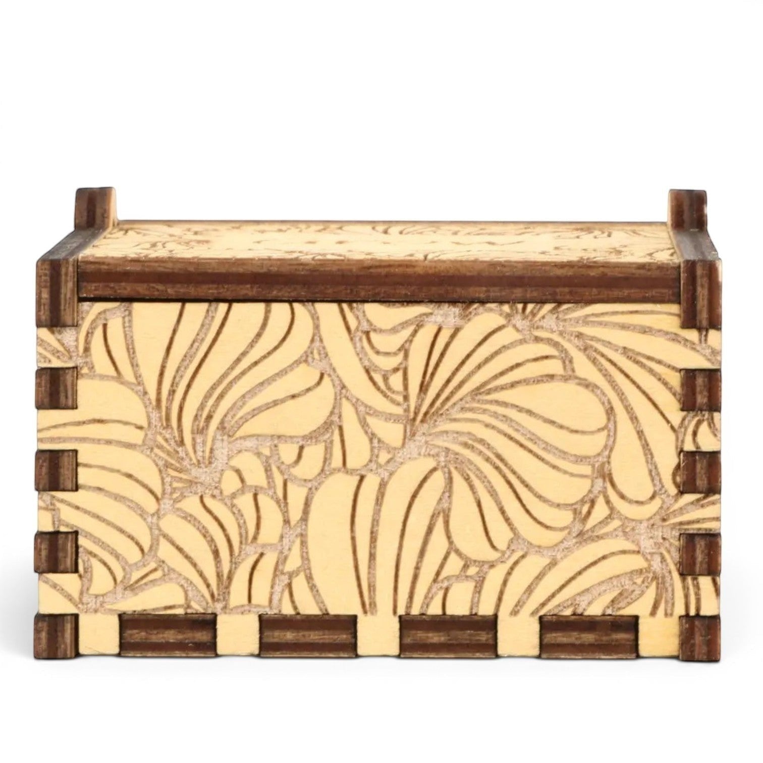 Enchanted Music Boxes plywood hand-crank music box with laser-engraved floral petal patterns on a light wood finish.