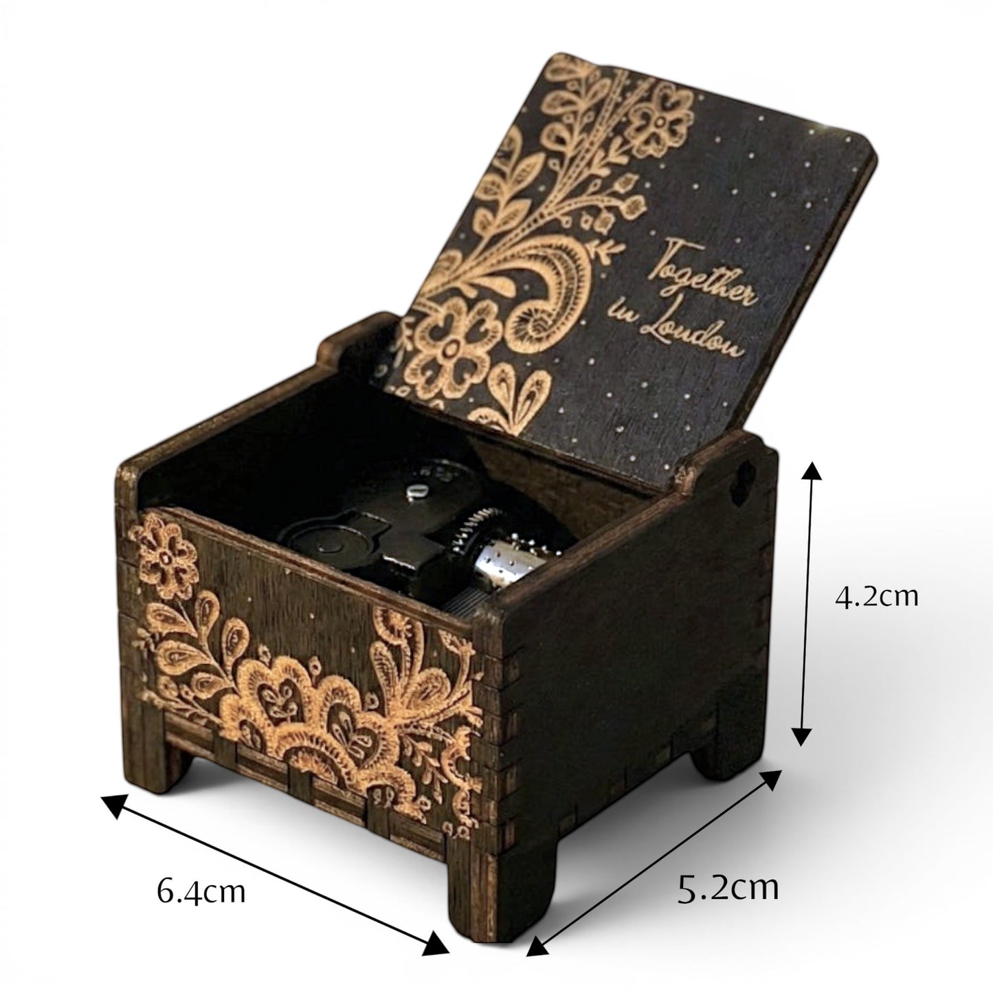 Enchanted Music Boxes ethnic nature wind-up music box in dark plywood with intricate floral engraving and custom text.