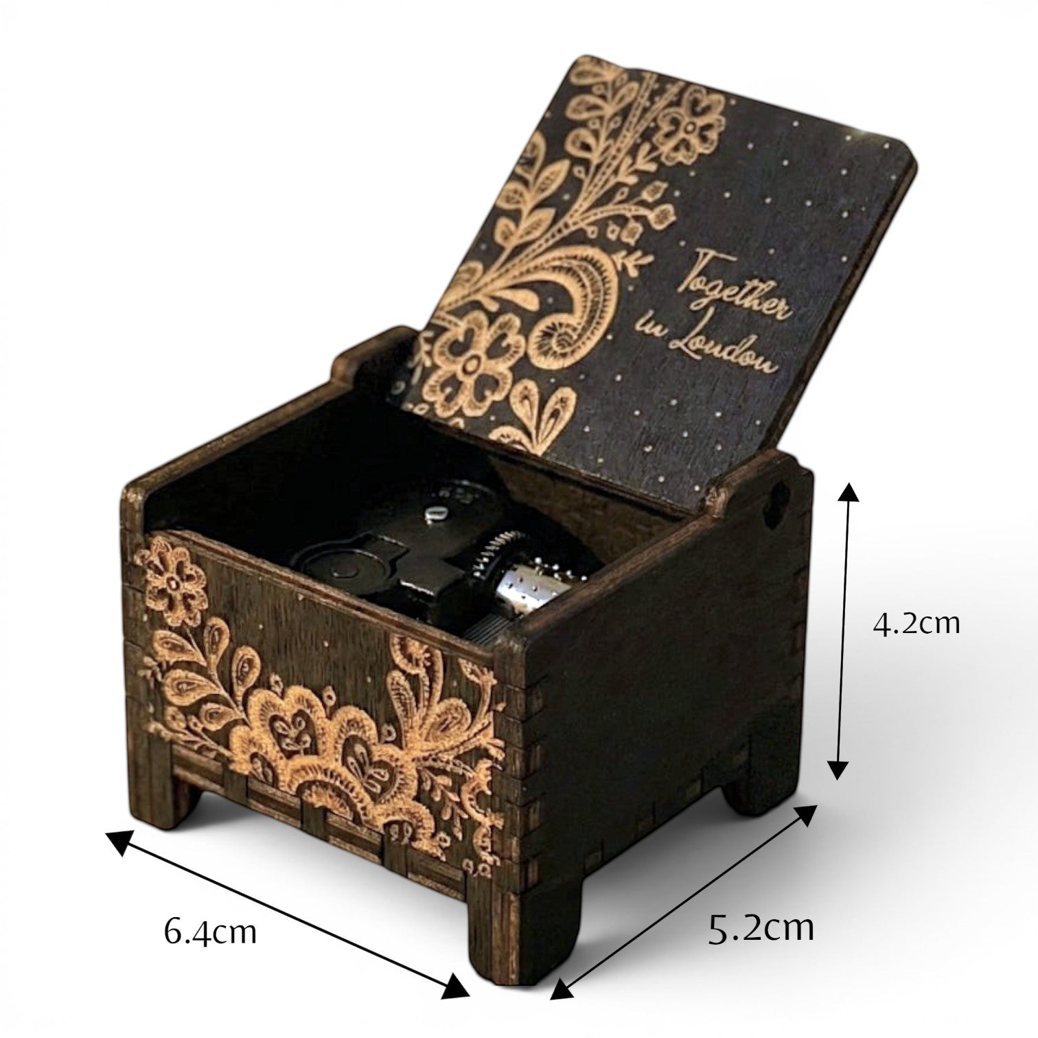 Enchanted Music Boxes ethnic nature wind-up music box in dark plywood with intricate floral engraving and custom text.