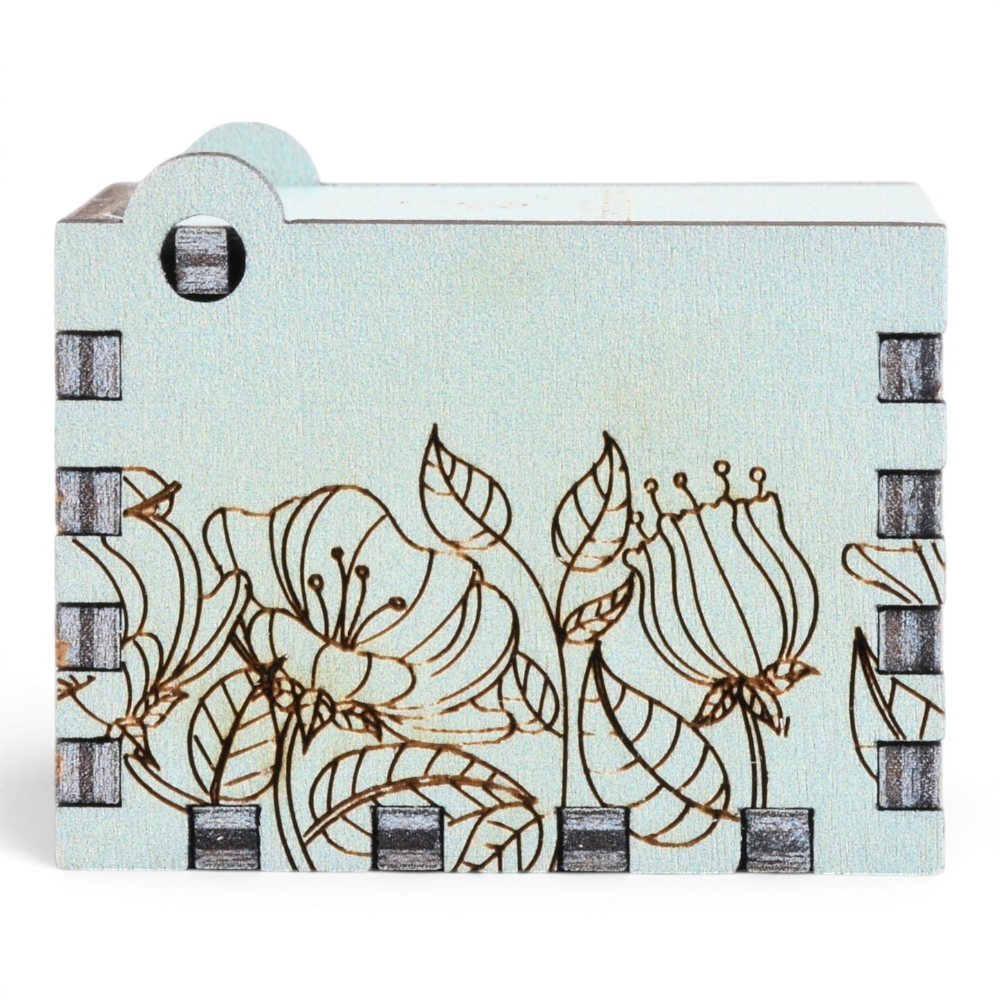 Enchanted Music Boxes light blue plywood music box featuring delicate laser-engraved floral and leaf illustrations.