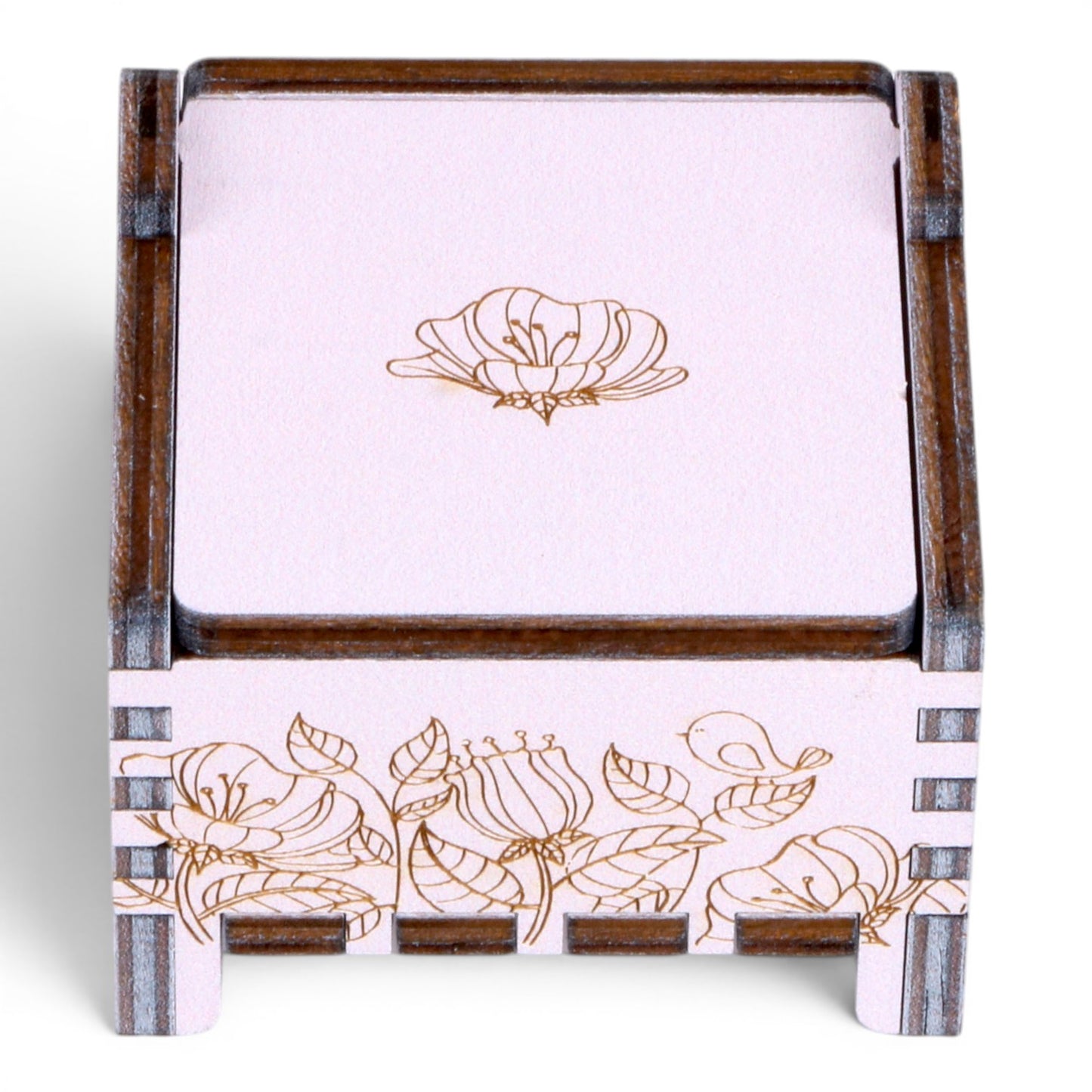 Enchanted Music Boxes wind-up music box in light purple and dark wood with engraved floral and bird designs.