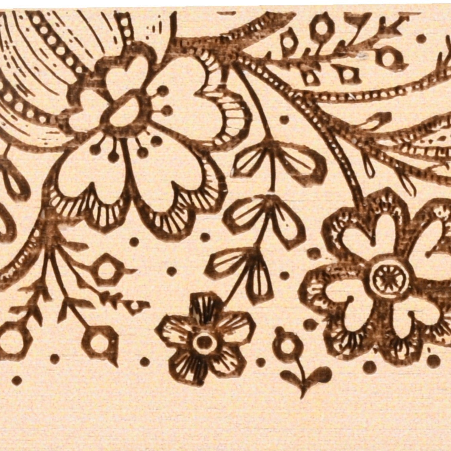 Enchanted Music Boxes plywood music box featuring intricate folk art floral patterns and dotted details.