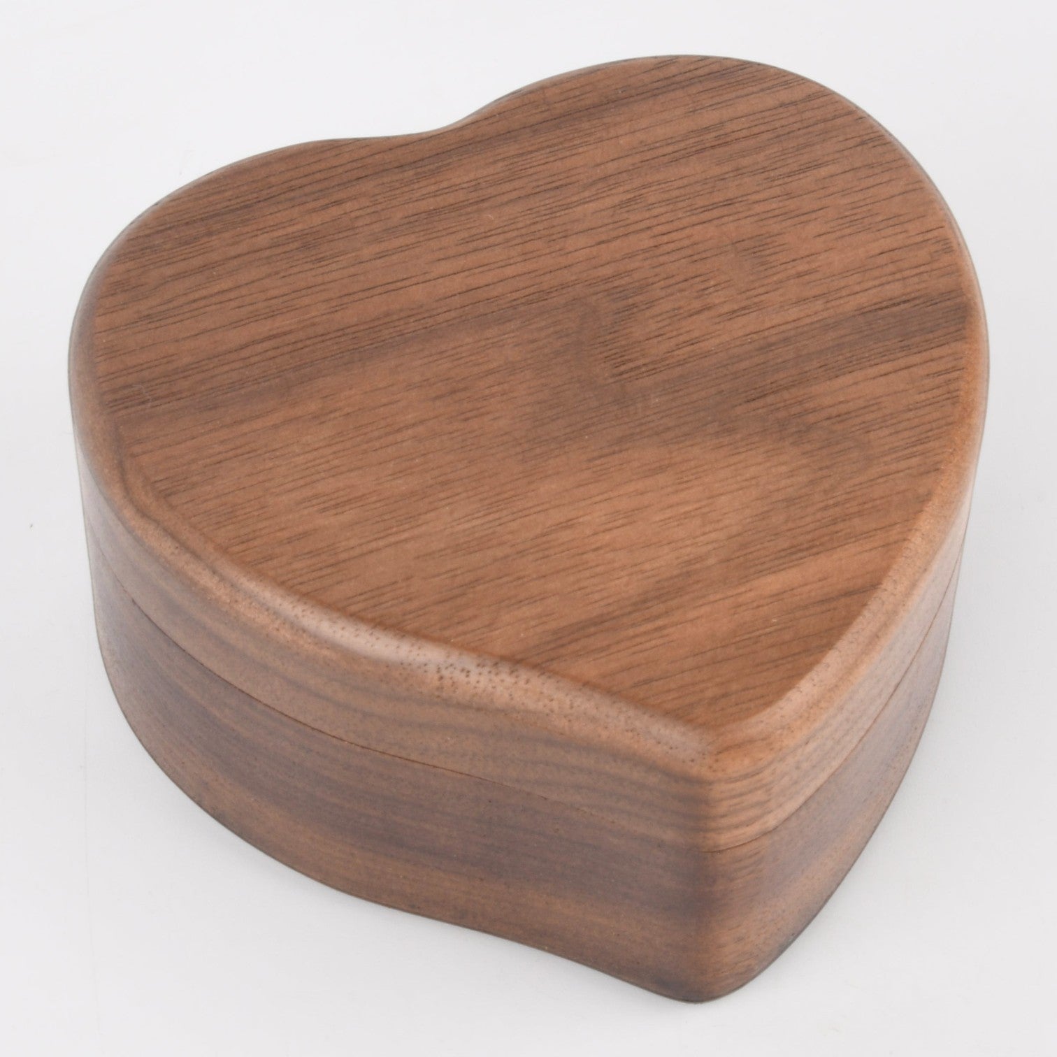 Enchanted Music Boxes heart-shaped wooden wind-up music box with a natural dark wood grain finish.