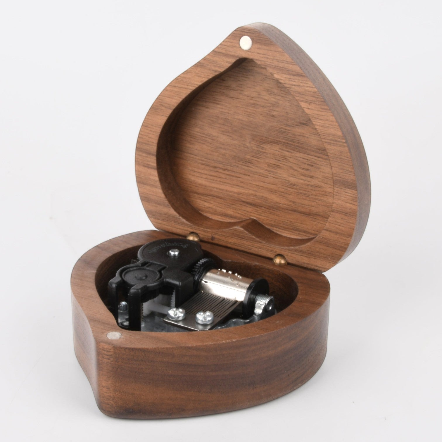 Enchanted Music Boxes heart-shaped wooden wind-up music box with visible metal mechanism inside