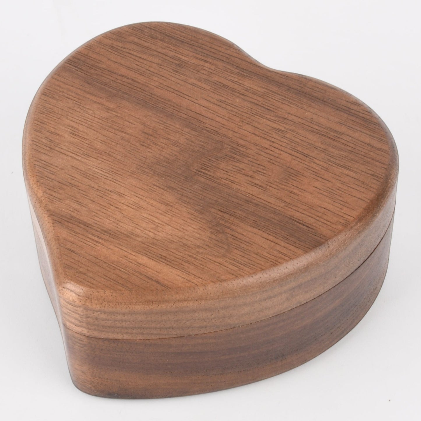 Enchanted Music Boxes heart-shaped wooden wind-up music box with a natural dark wood grain finish.