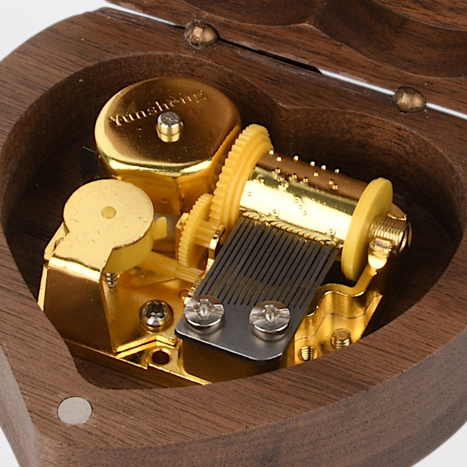 Enchanted Music Boxes heart-shaped wooden music box with exposed gold-tone metal wind-up mechanism