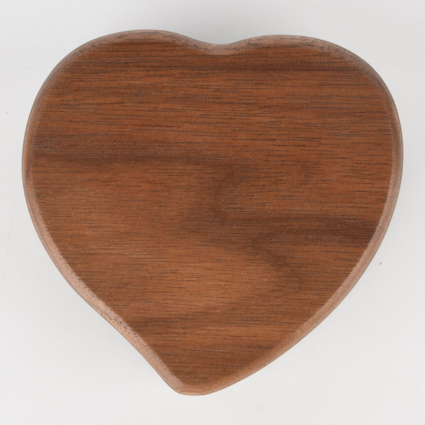 Enchanted Music Boxes heart-shaped wooden wind-up music box with a natural brown plywood finish.