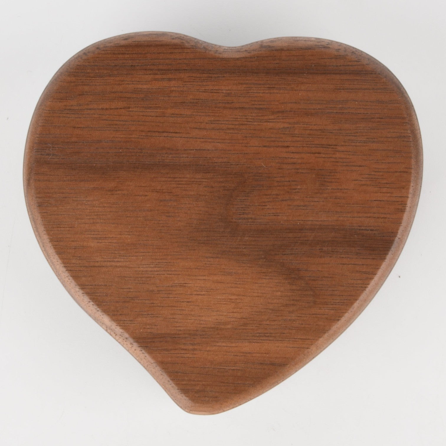 Enchanted Music Boxes heart-shaped wooden wind-up music box with a natural brown plywood finish.
