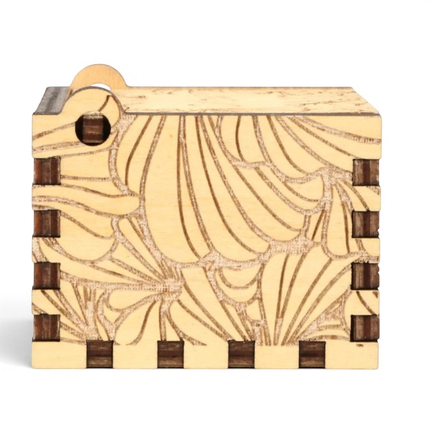 Enchanted Music Boxes hand-crank music box in light plywood with intricate laser-engraved flower petal patterns.