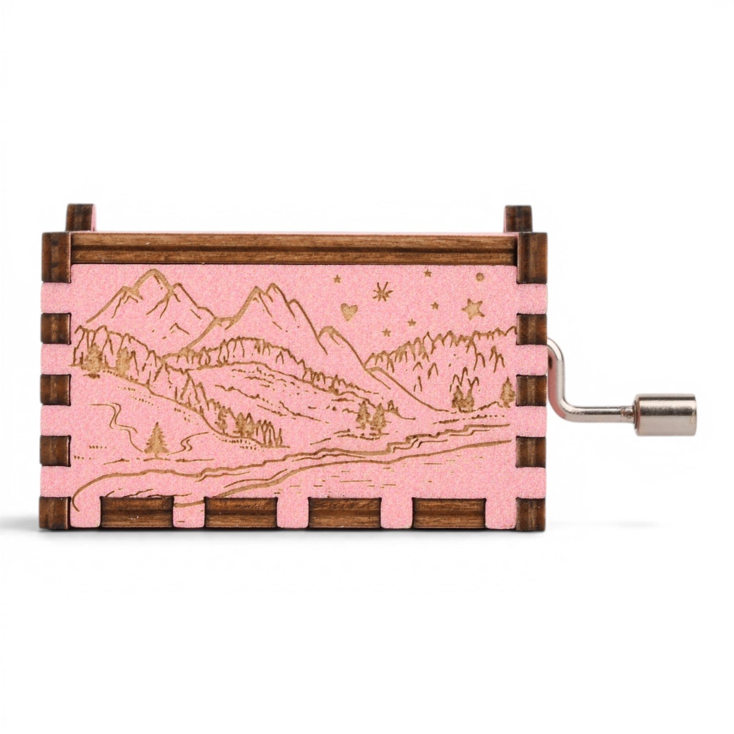Enchanted Music Boxes hand-crank music box with pink alpine mountain engraving and dark wood finger joint frame.