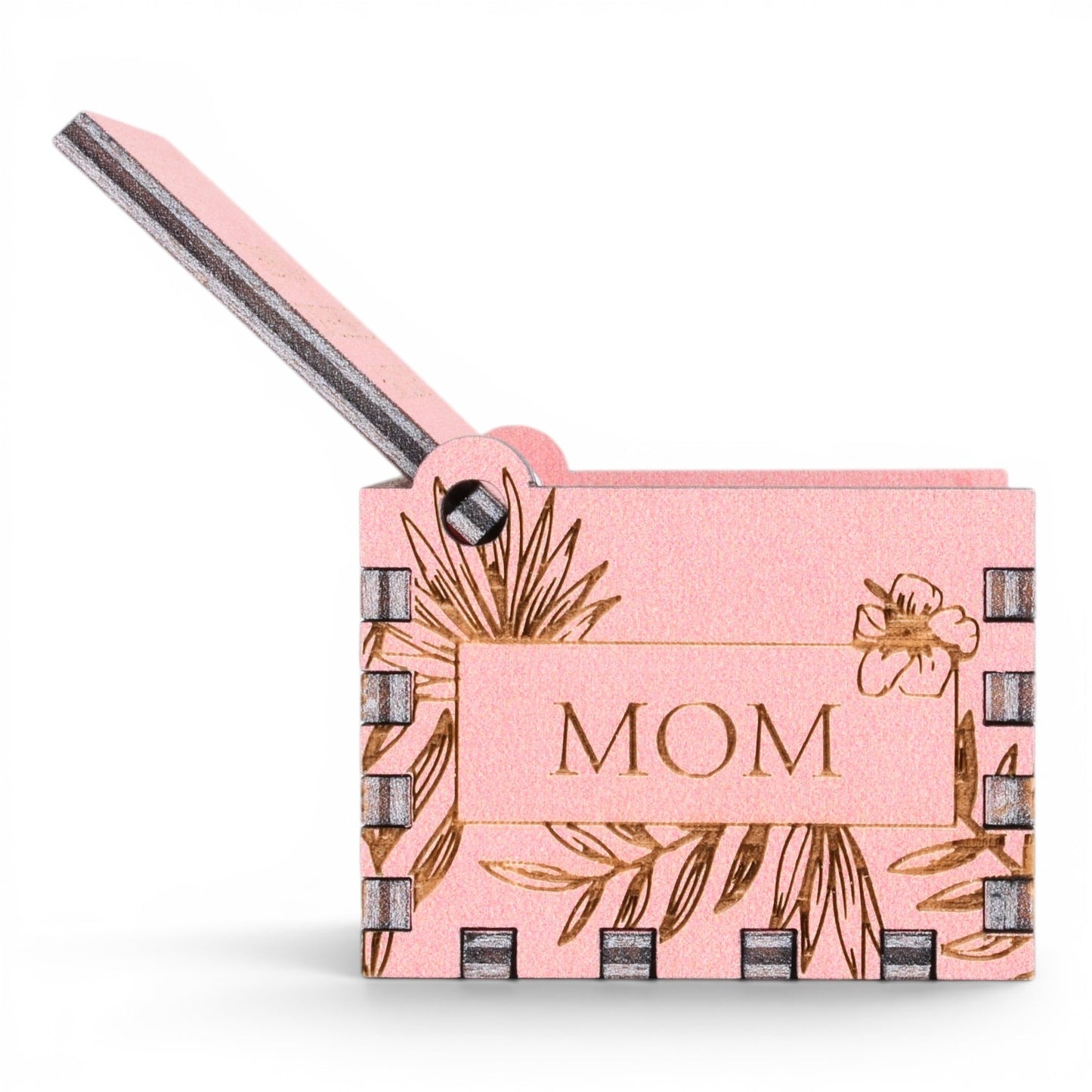 Enchanted Music Boxes pink plywood hand-crank music box with laser-engraved hibiscus flowers and MOM text on lid