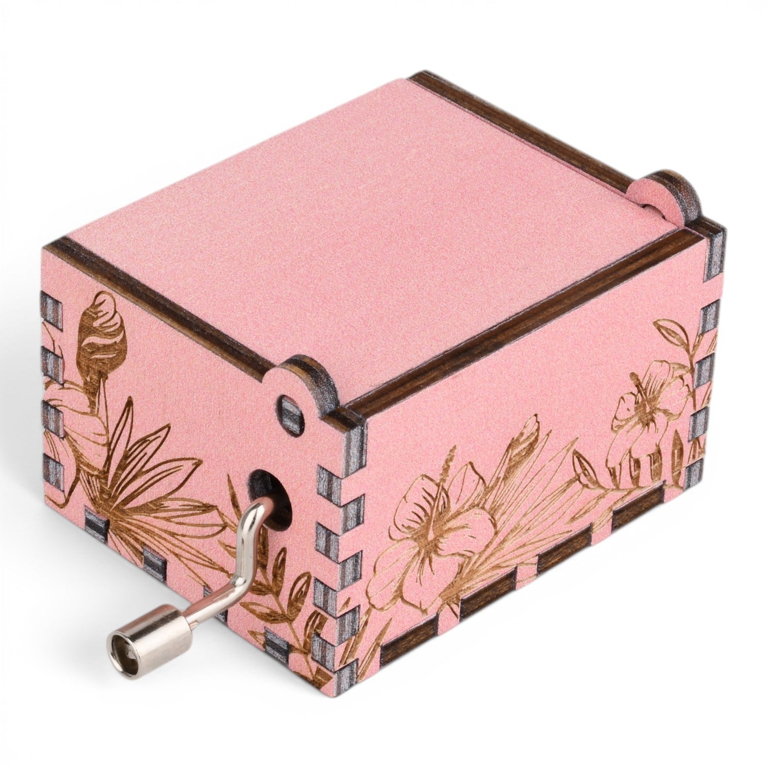 Enchanted Music Boxes pink plywood hand-crank music box with laser-engraved hibiscus flowers and palm leaf patterns.