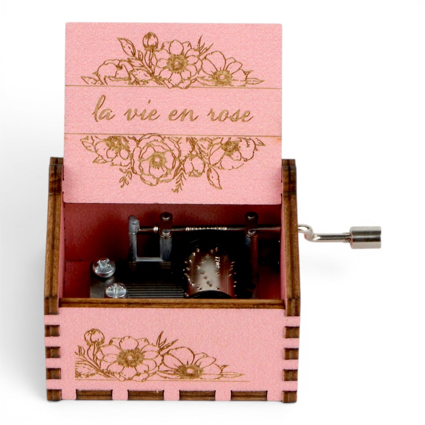 Enchanted Music Boxes pink plywood hand-crank music box with floral engravings and la vie en rose text on the lid