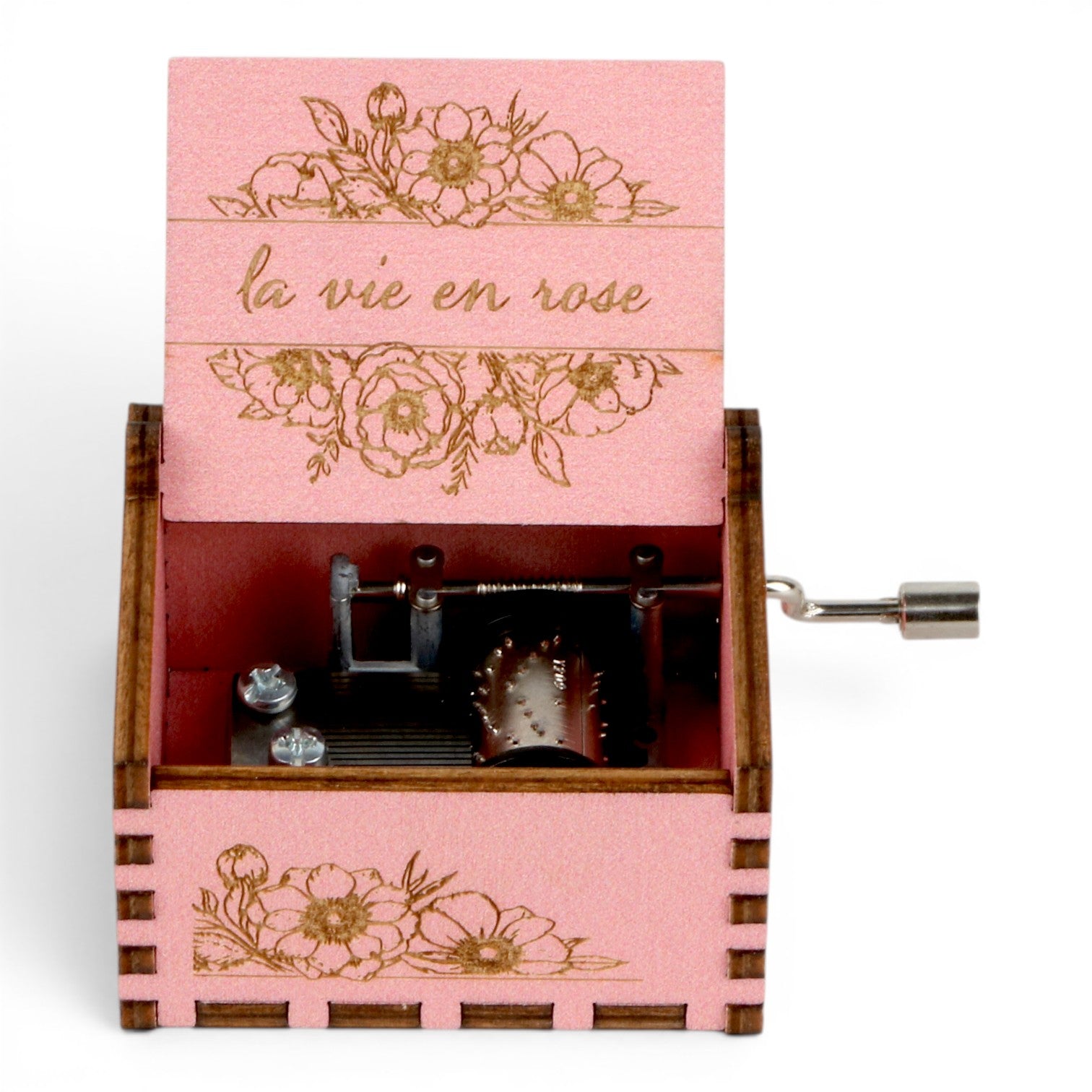 Enchanted Music Boxes pink plywood hand-crank music box with floral engravings and la vie en rose text on the lid
