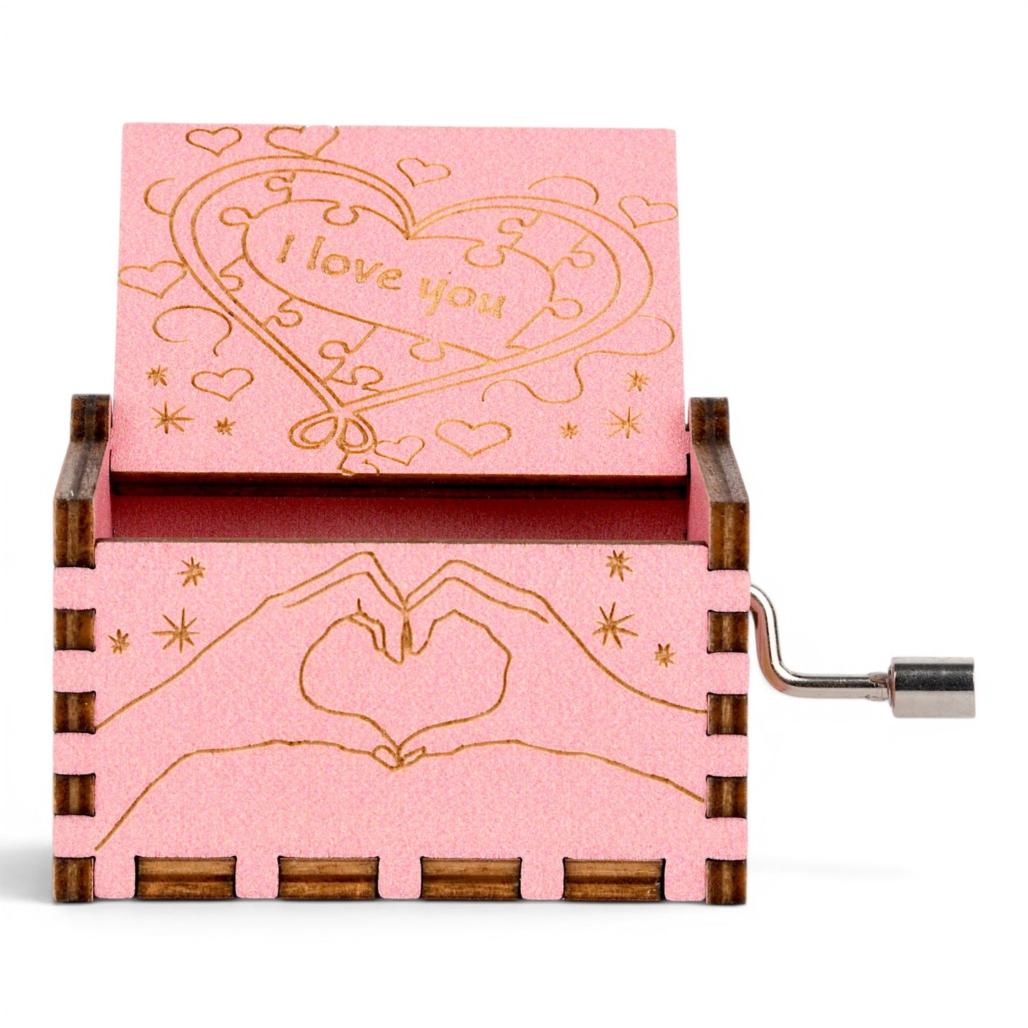 Enchanted Music Boxes pink plywood hand-crank music box with heart puzzle piece engraving and hand heart design