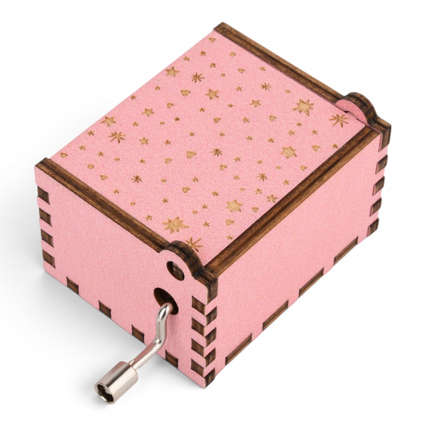 Enchanted Music Boxes pink plywood hand-crank music box with gold star pattern and dark wood finger-joint edges.
