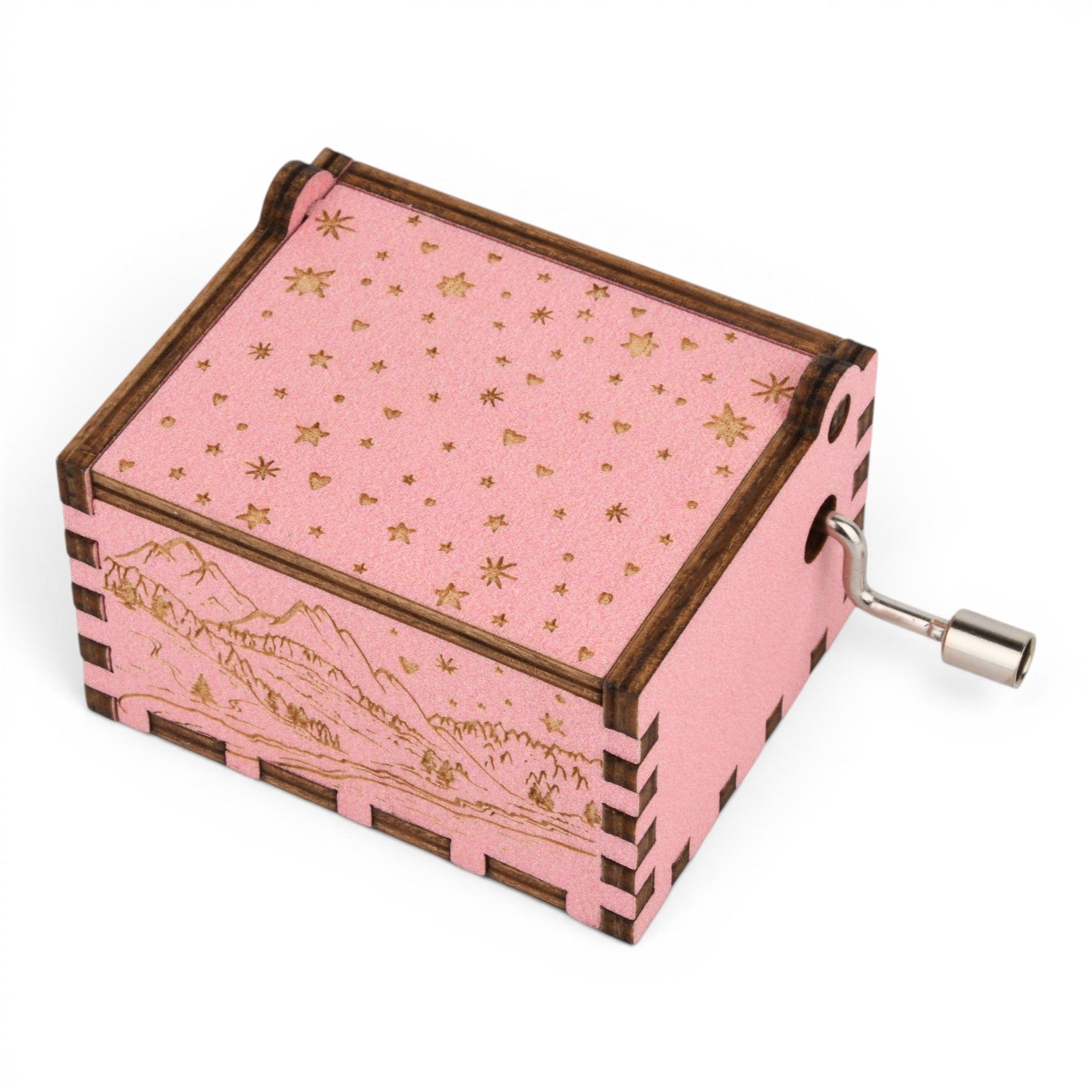Enchanted Music Boxes pink plywood hand-crank music box with gold star lid and engraved alpine mountain side detail.