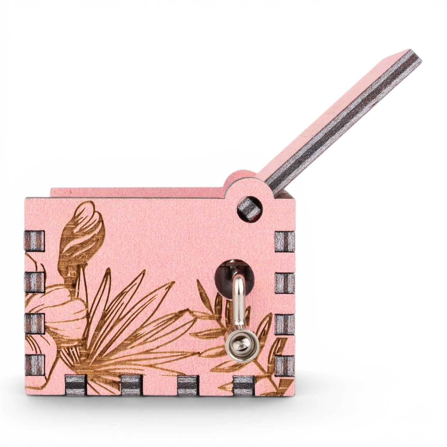 Enchanted Music Boxes pink plywood music box with laser-engraved hibiscus and palm leaf tropical design and hand crank.