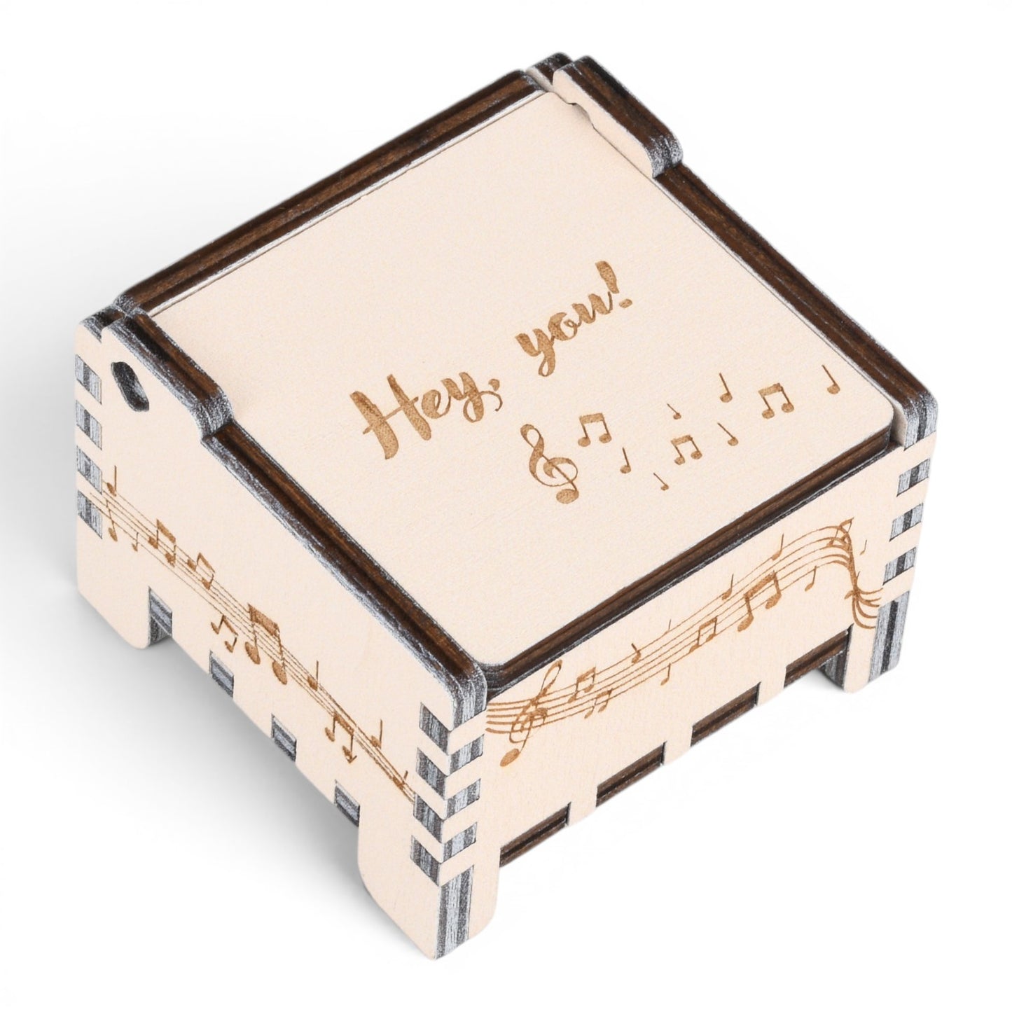 Enchanted Music Boxes plywood wind-up music box with musical note engravings and Hey you text on the lid.