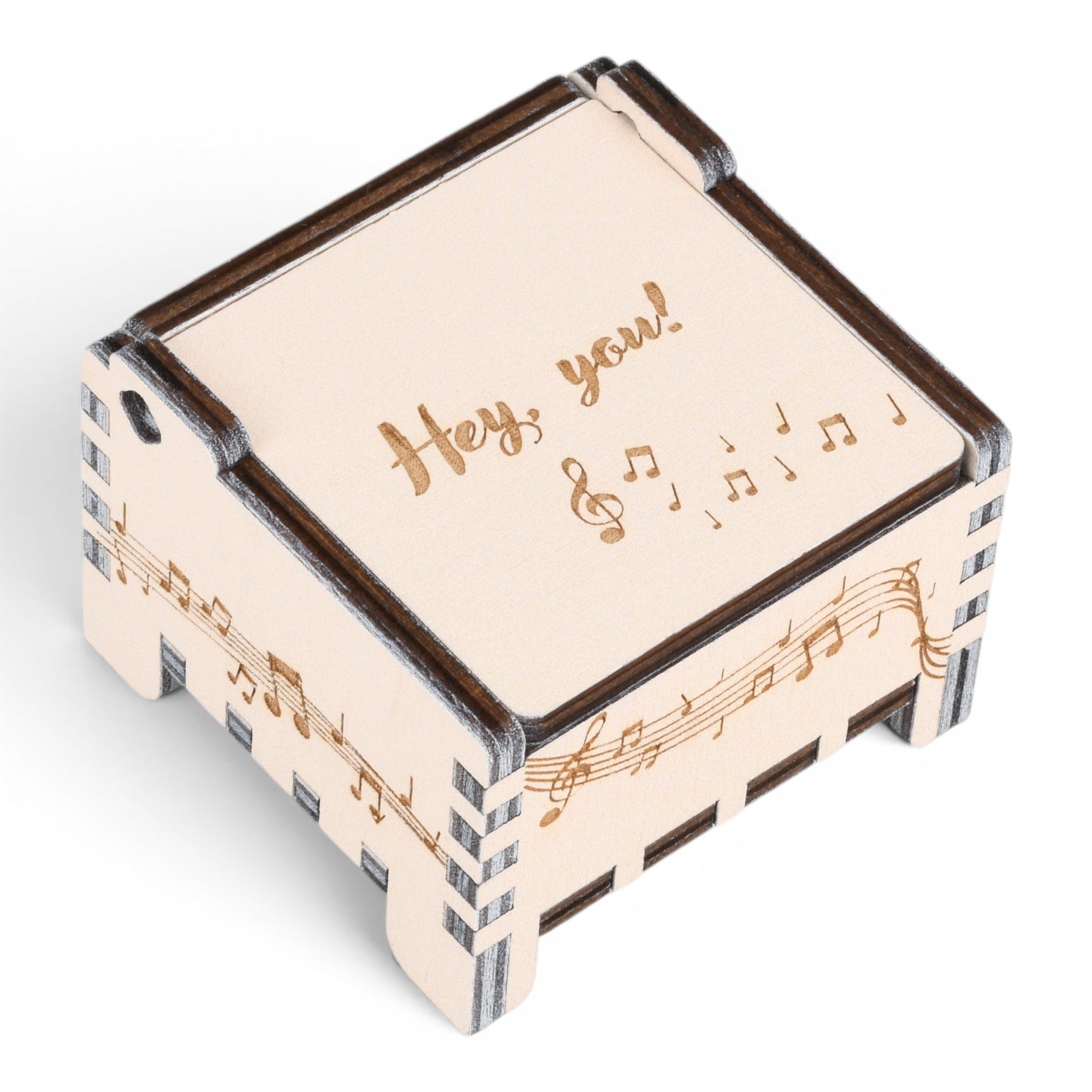 Enchanted Music Boxes plywood wind-up music box with musical note engravings and Hey you text on the lid.