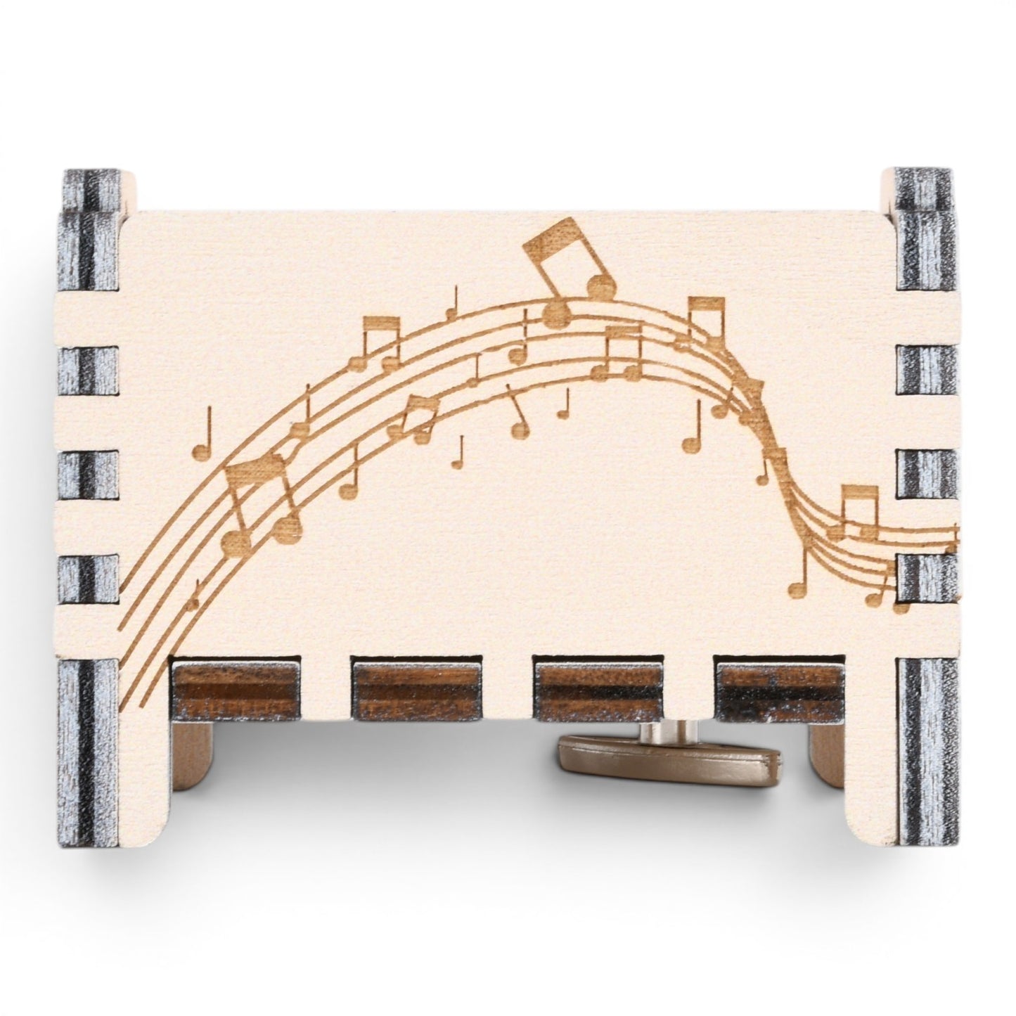 Enchanted Music Boxes plywood music box featuring laser-engraved musical staves and notes on a light wood panel.