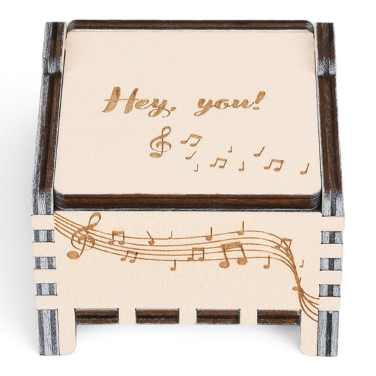 Enchanted Music Boxes plywood music box with engraved musical notes and Hey you text on the lid.