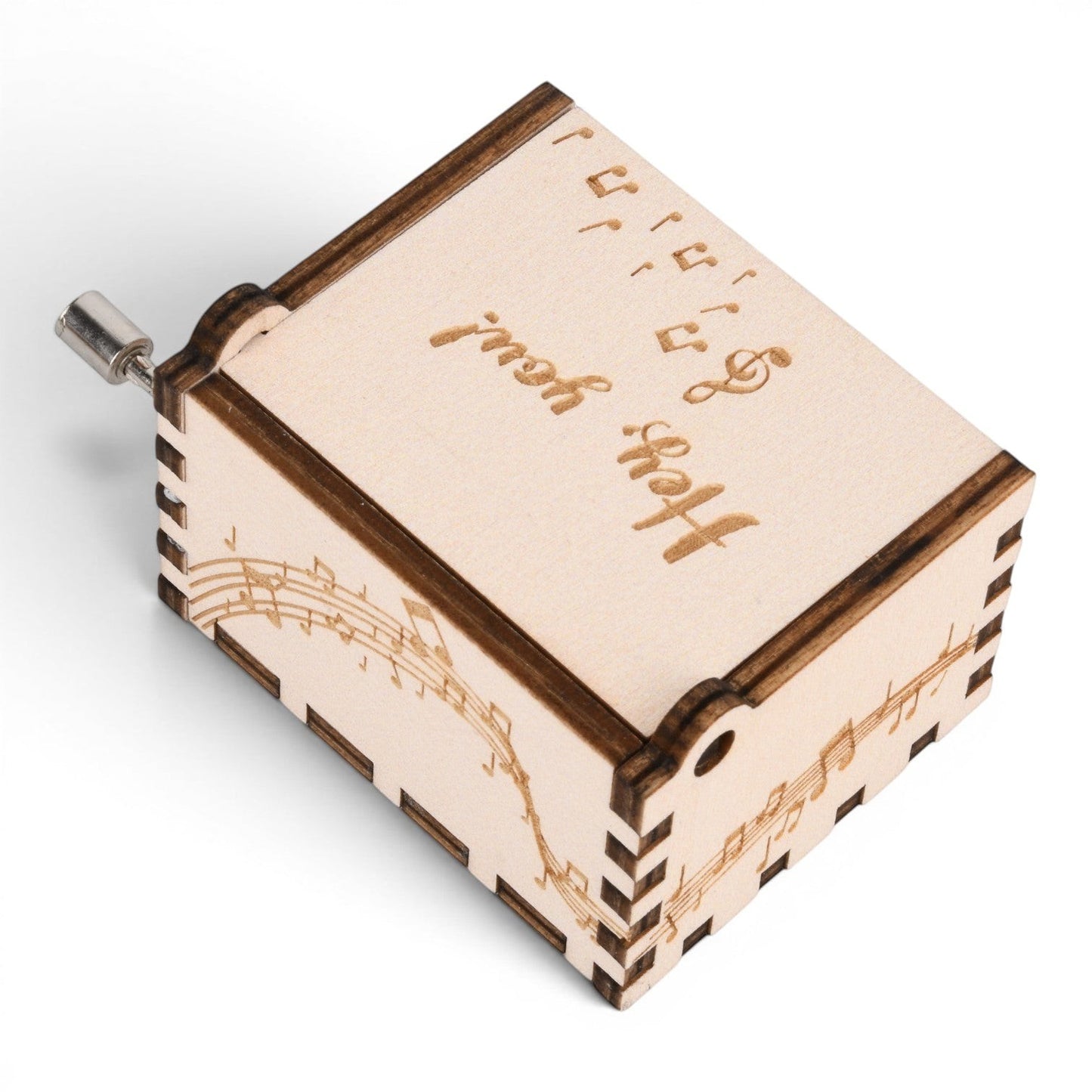 Enchanted Music Boxes hand-crank music box made of light plywood with engraved music notes and cursive text