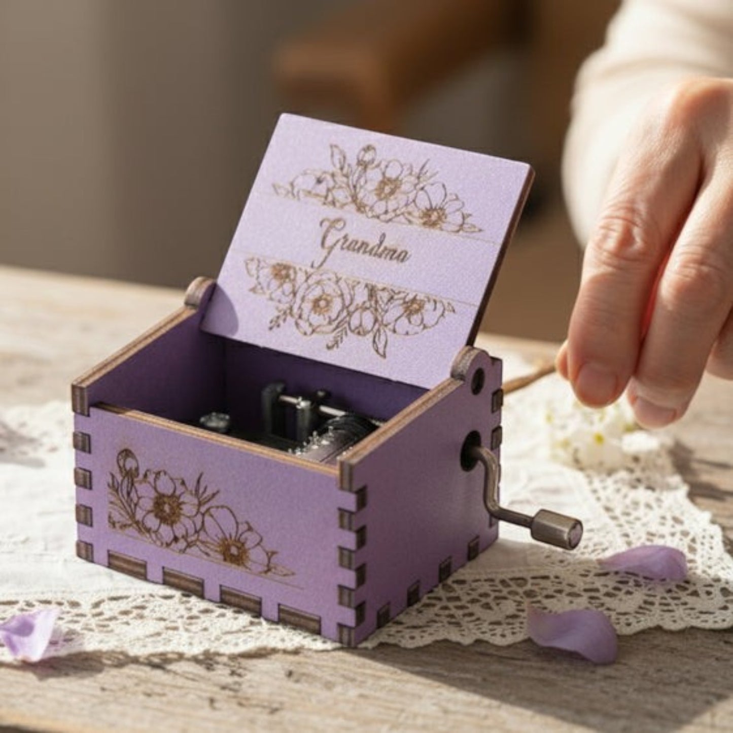 Enchanted Music Boxes purple plywood hand-crank music box with floral engravings and Grandma text on the lid