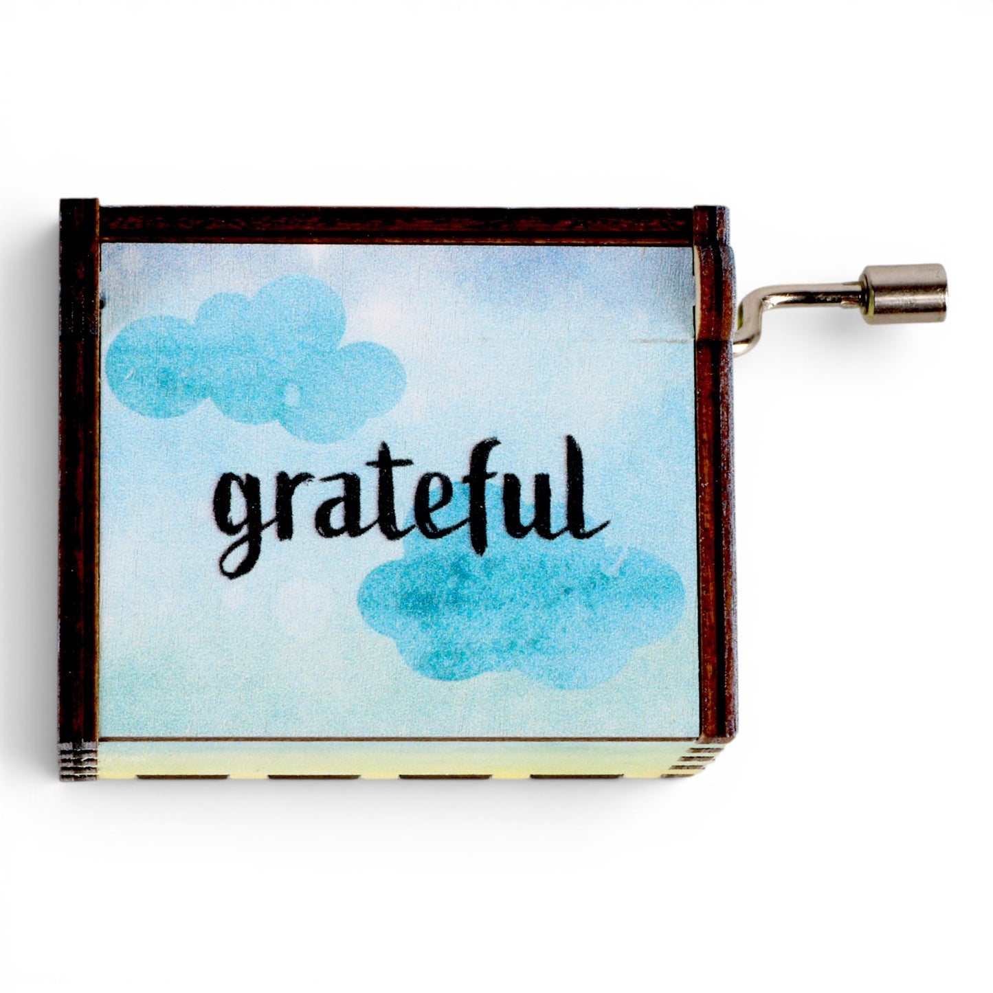 Enchanted Music Boxes rainbow hand-crank music box with watercolour sky design and the word grateful on the lid.