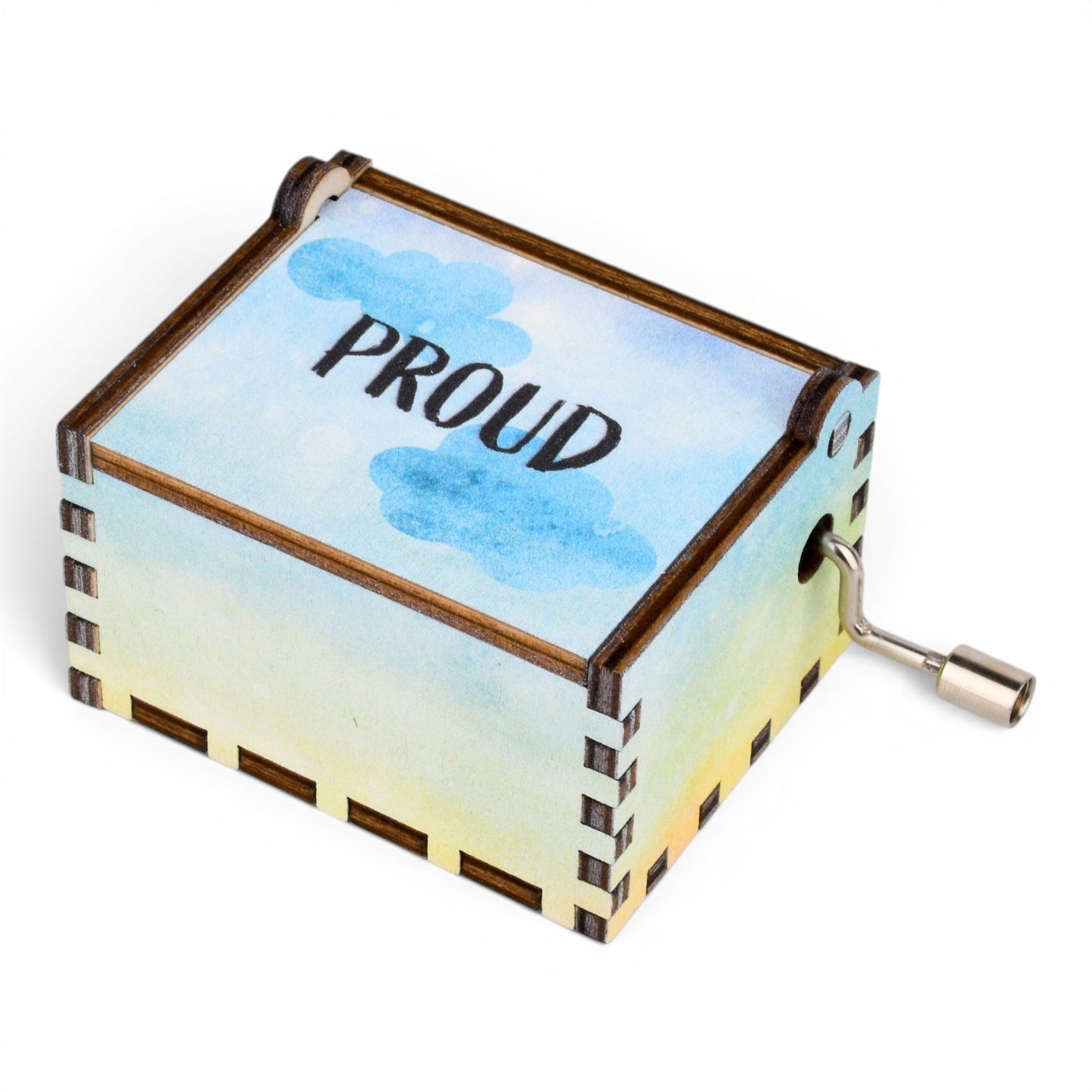 Enchanted Music Boxes rainbow plywood hand-crank music box with watercolour sky design and Proud text on the lid.