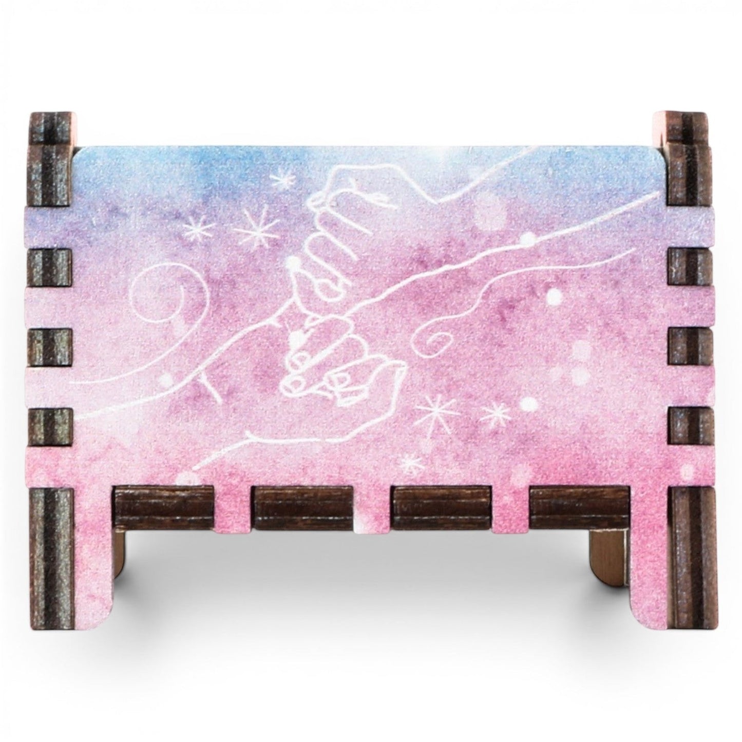 Enchanted Music Boxes rainbow plywood music box featuring a watercolour pinky-promise design with white line art.