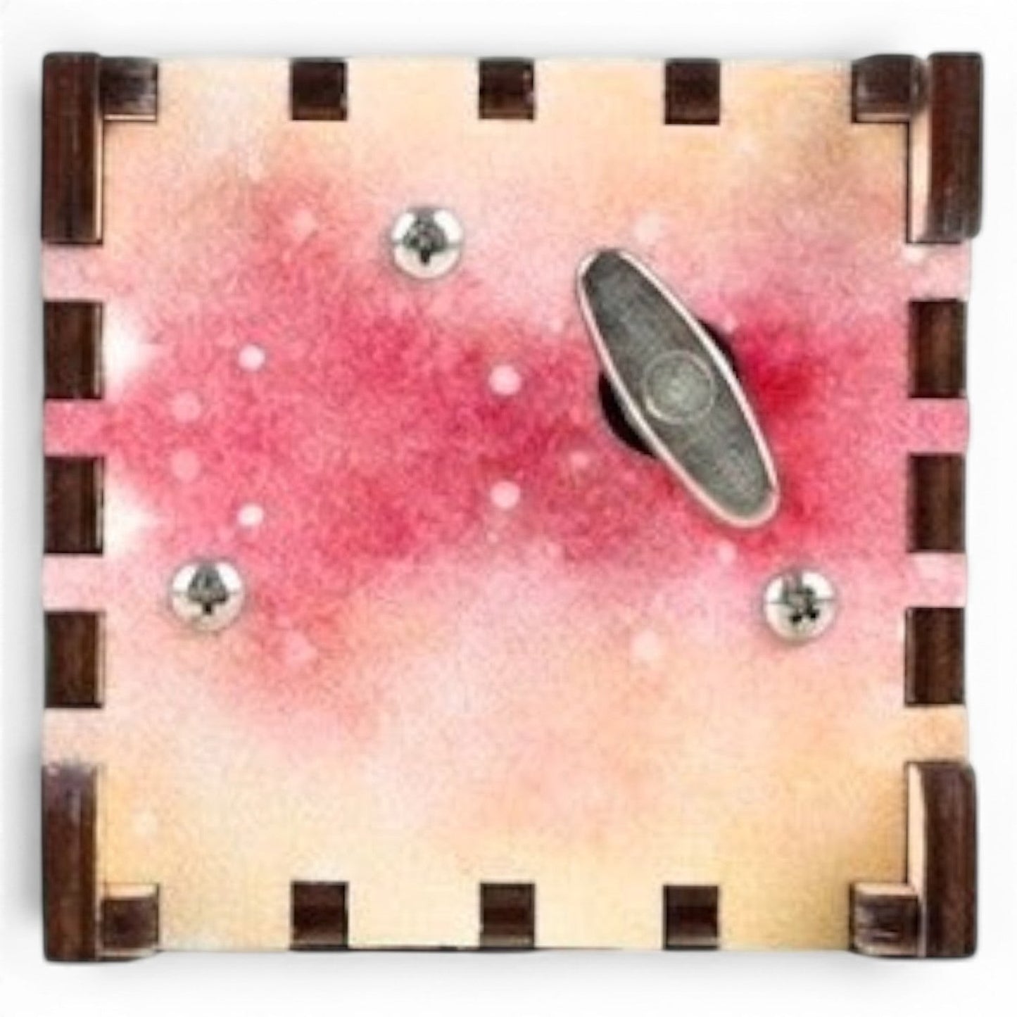 Enchanted Music Boxes rainbow watercolour plywood music box with a metal wind-up key on the underside.