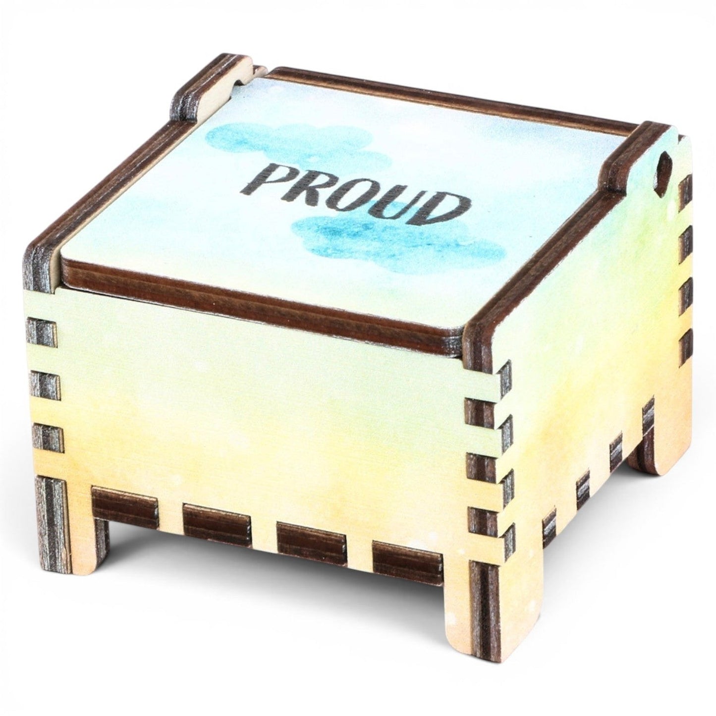 Enchanted Music Boxes rainbow plywood wind-up music box with watercolour gradient and Proud engraving on the lid.
