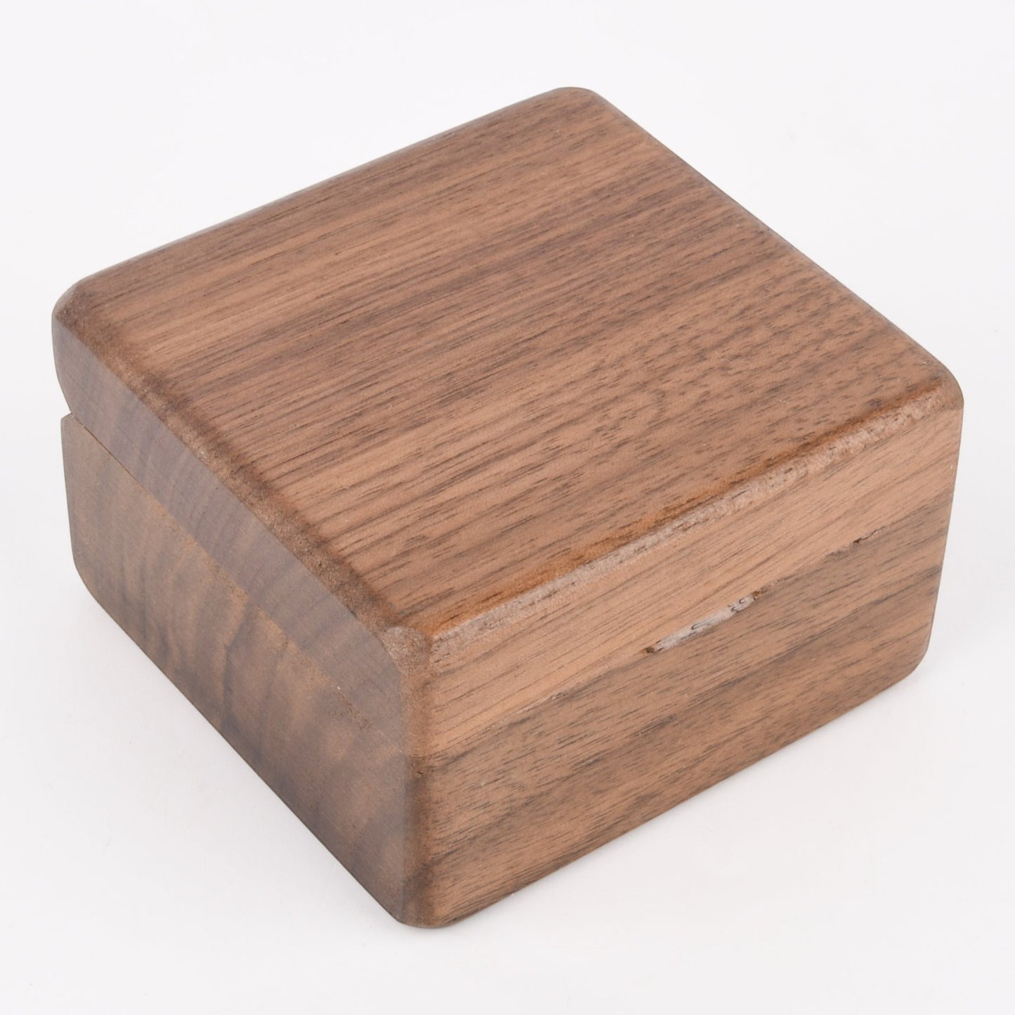 Enchanted Music Boxes square wooden wind-up music box with a natural dark wood grain finish.