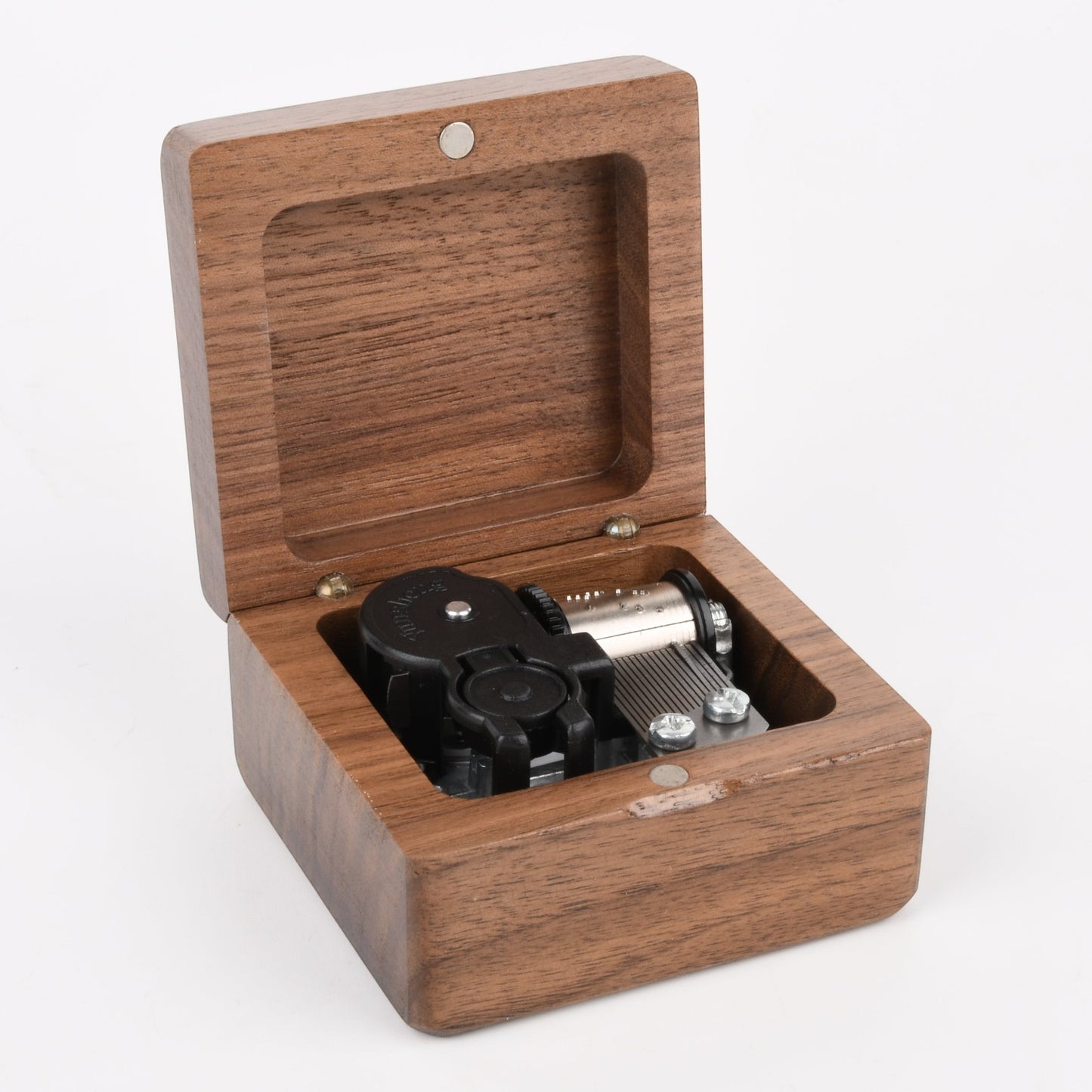 Enchanted Music Boxes square wooden wind-up music box with an open lid showing the internal metal mechanism