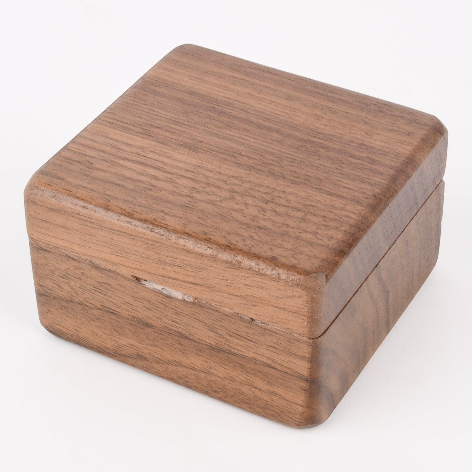 Enchanted Music Boxes square wooden wind-up music box with a natural plywood finish and minimalist design.