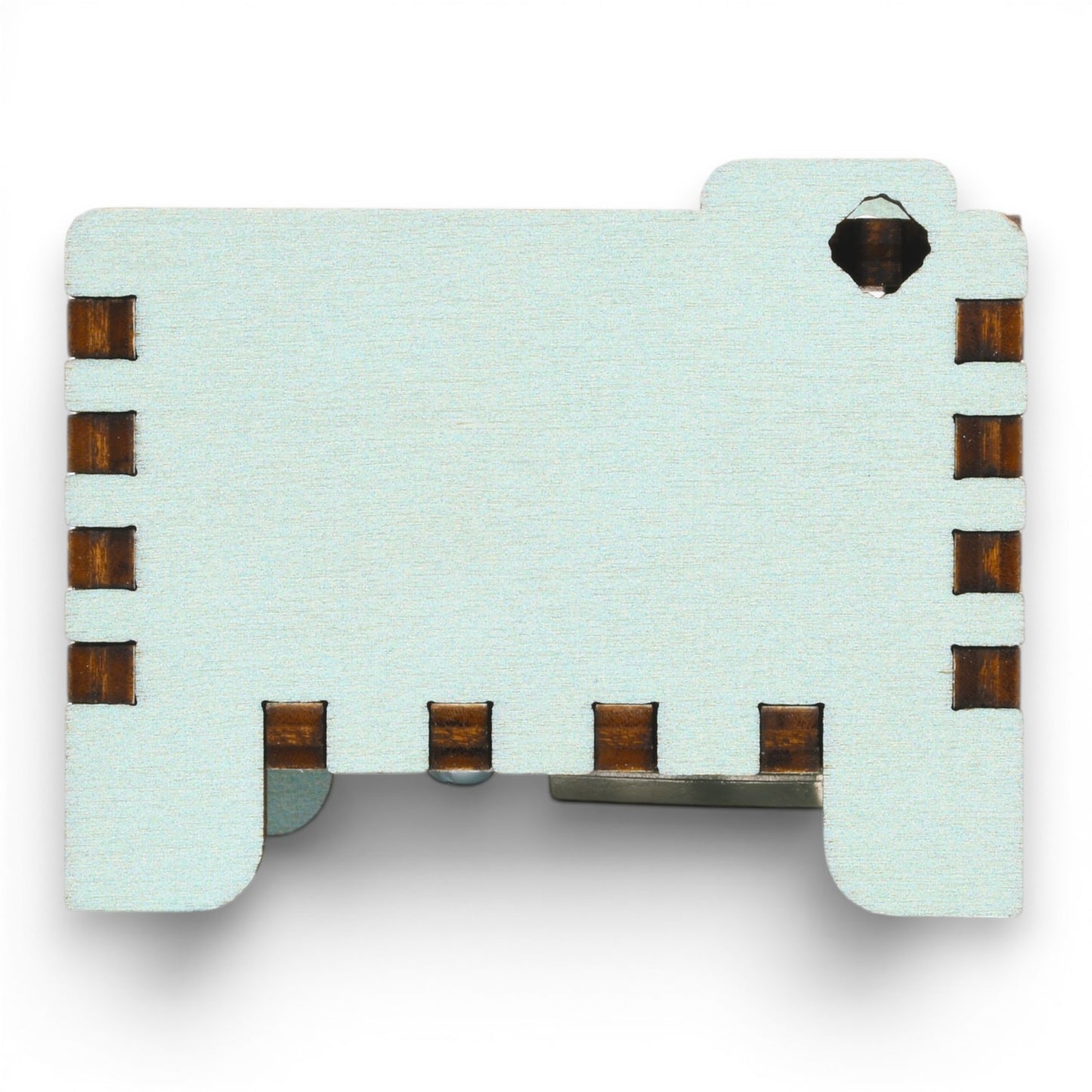 Side view of Enchanted Music Boxes teal painted plywood music box featuring dark finger joint edges and a starry night engraving.