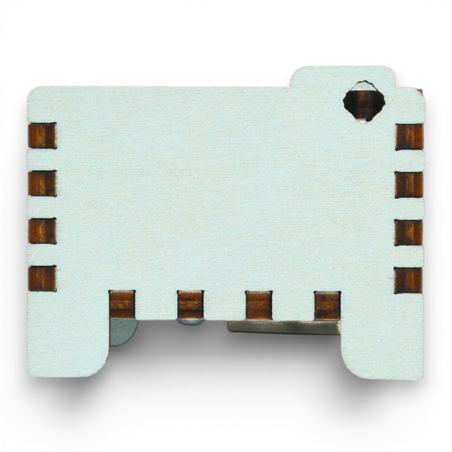 Side view of Enchanted Music Boxes teal painted plywood music box featuring dark finger joint edges and a starry night engraving.