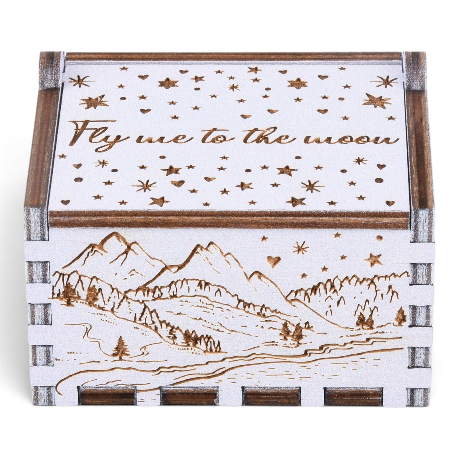 Enchanted Music Boxes plywood hand-crank music box with laser-engraved alpine mountain scene and starry night lid design.