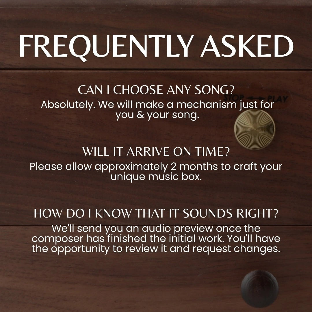 Enchanted Music Boxes 78-note walnut music box featuring a brass wind-up key and custom song options.