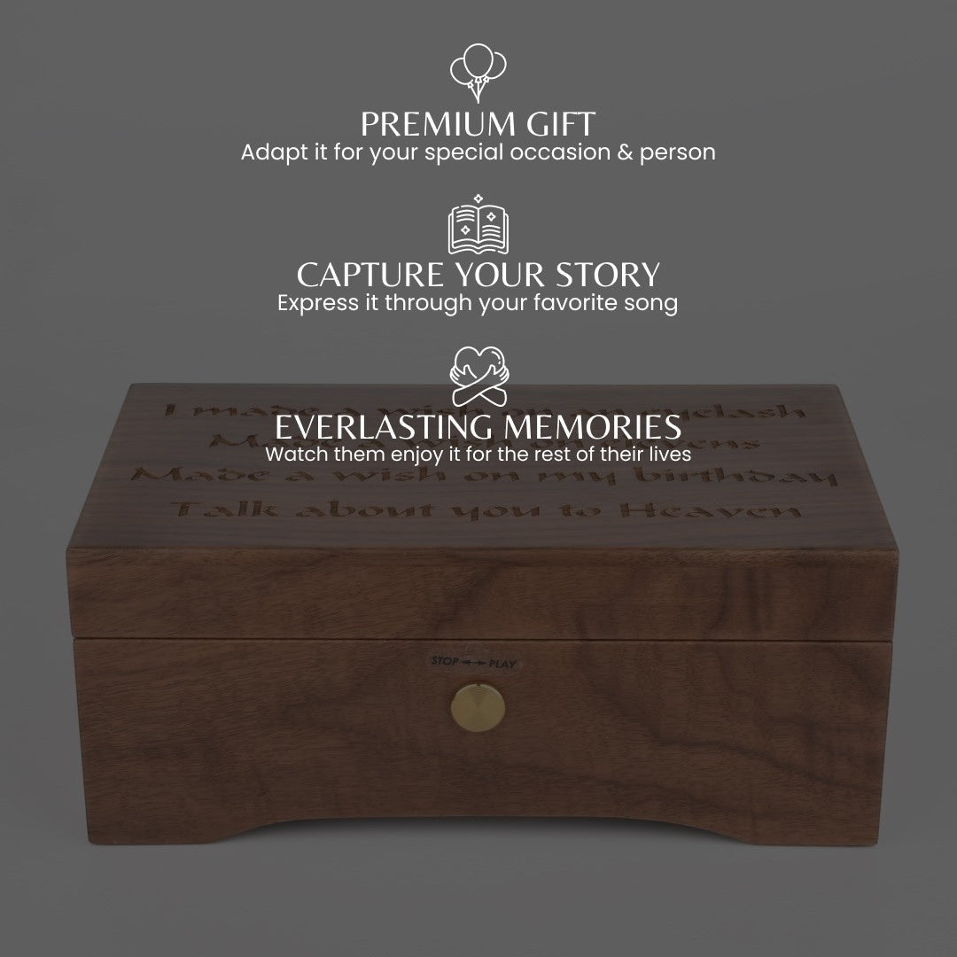 Enchanted Music Boxes walnut wood music box with custom engraved lid and front wind-up key mechanism