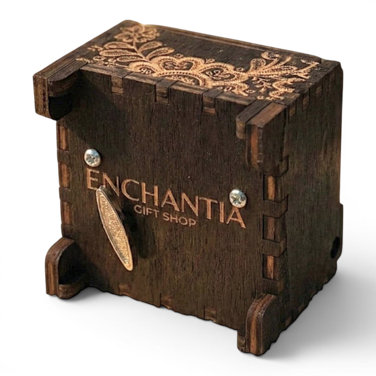 Bottom view of Enchanted Music Boxes wind-up music box in dark stained plywood with intricate floral laser-engraved patterns